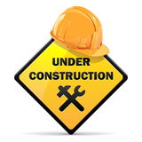 an under construction sign with a yellow hard hat on top